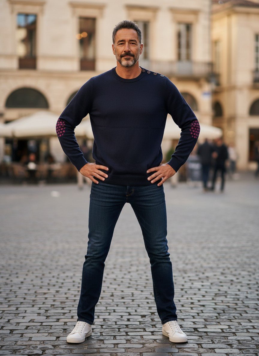 Baie des Caps navy blue fine knit wool sweater with pink fleur-de-lis elbow patches and shoulder buttons.