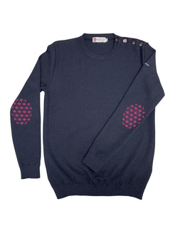 Baie des Caps navy blue 50% wool fine knit sweater with pink fleur-de-lis elbow patches and shoulder buttons.