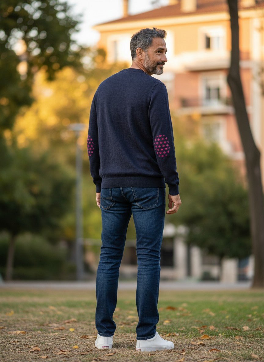 Baie des Caps navy blue fine knit wool sweater with pink fleur-de-lis elbow patches and shoulder buttons.