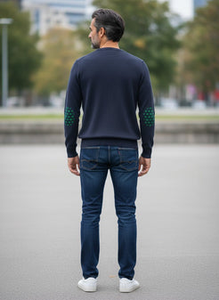 Baie des Caps navy blue fine knit wool sweater with green fleur-de-lis elbow patches and shoulder buttons.