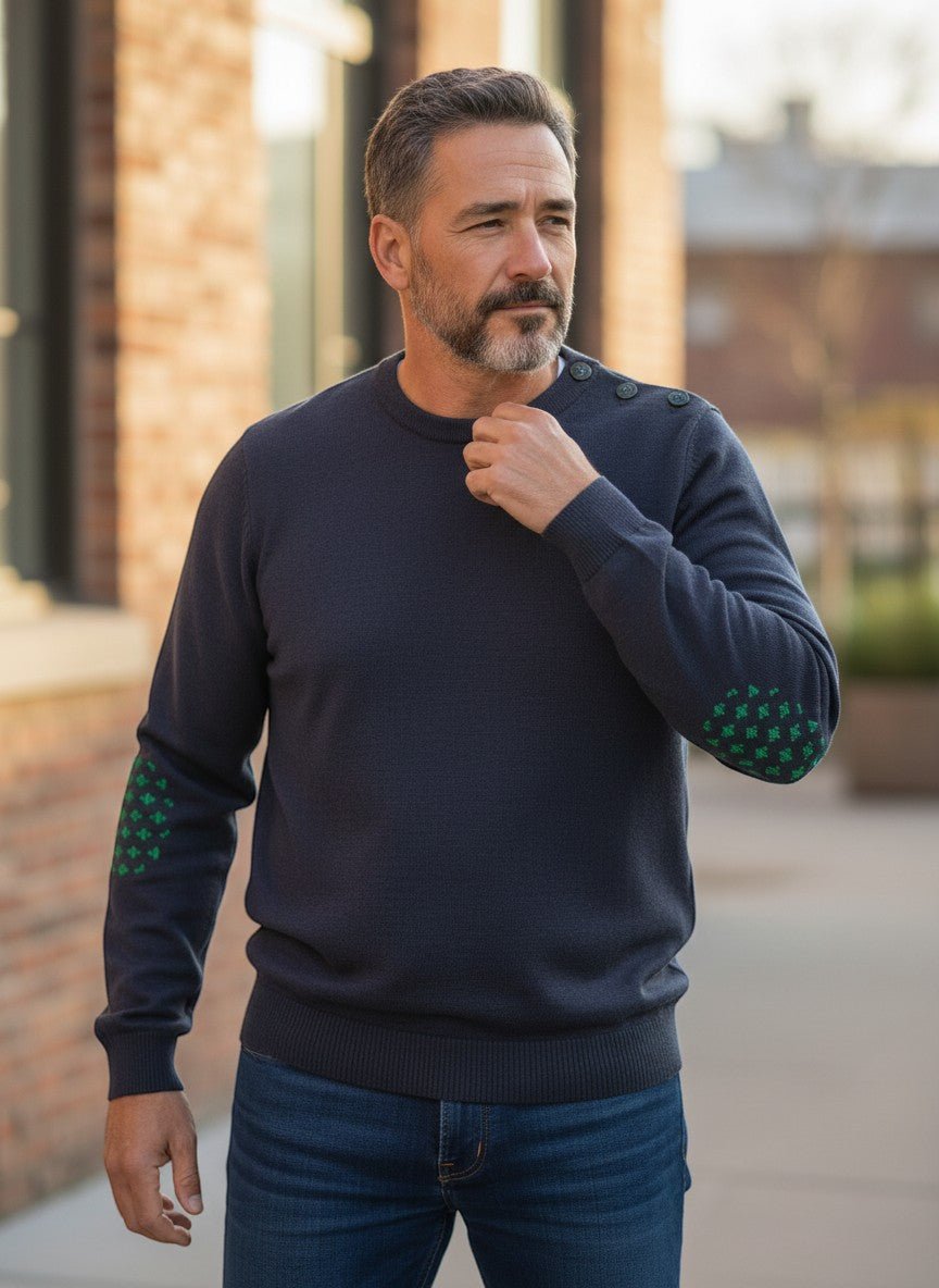 Baie des Caps navy blue fine knit wool sweater with green fleur-de-lis elbow patches and shoulder buttons.